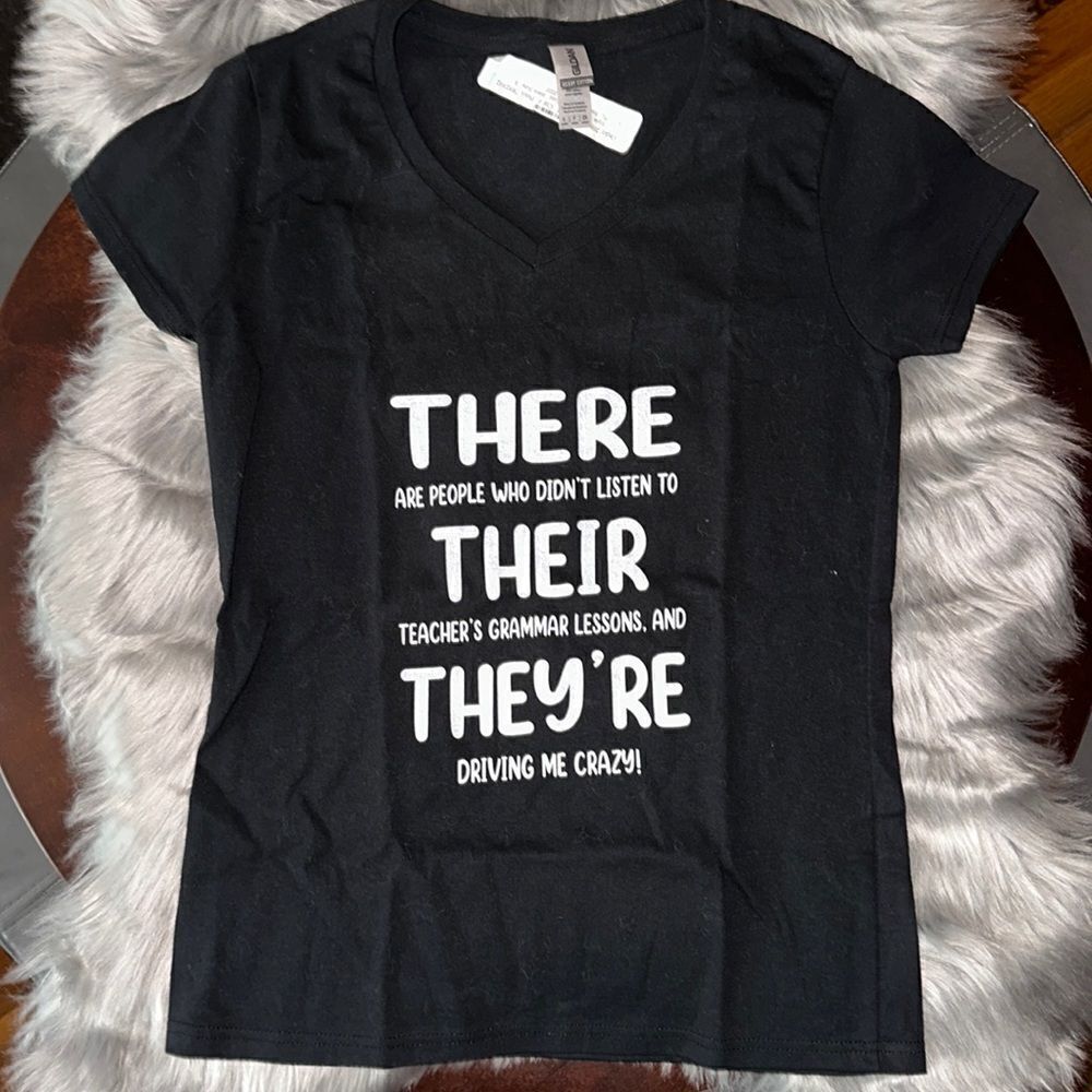 Brand new graphic T-shirt! There, their and they’re. Gilda’s size small.